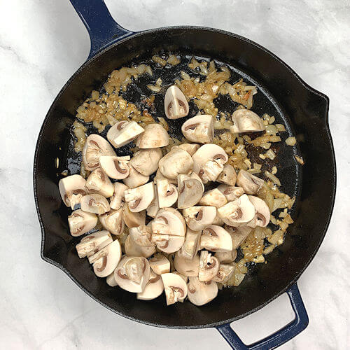 Mushroom added to onion and garlic in skillet.