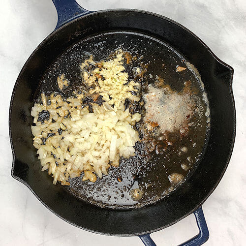 Onion and garlic sauteed in skillet.